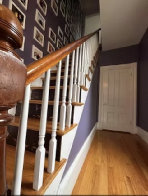 Beautiful wooden staircase with custom white balusters